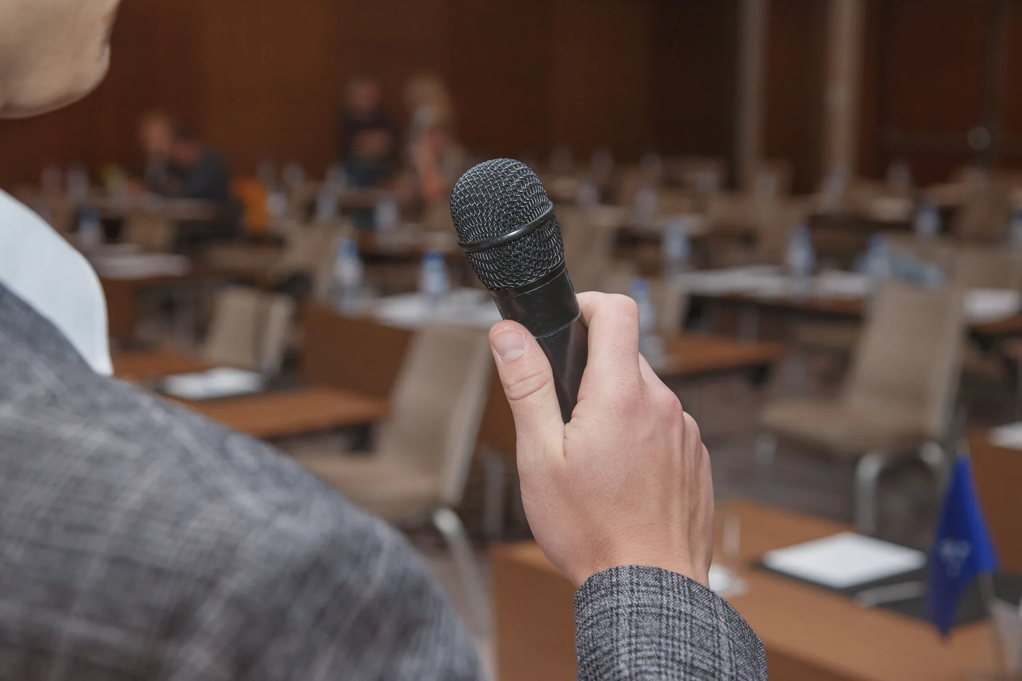 The speaker is rehearsing in anticipation of a speech at the conference.